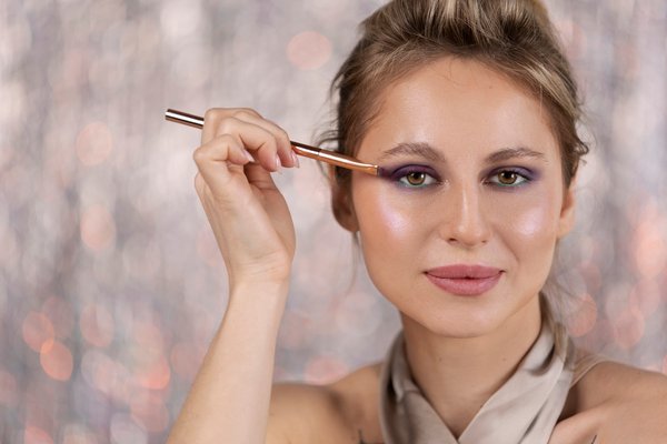 portrait makeup artist applying 