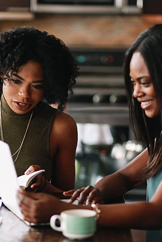 Two women looking at a document